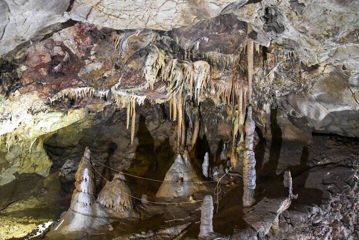 Interior view of Gadime Cave showing crystal formations and limestone walls in Kosovo